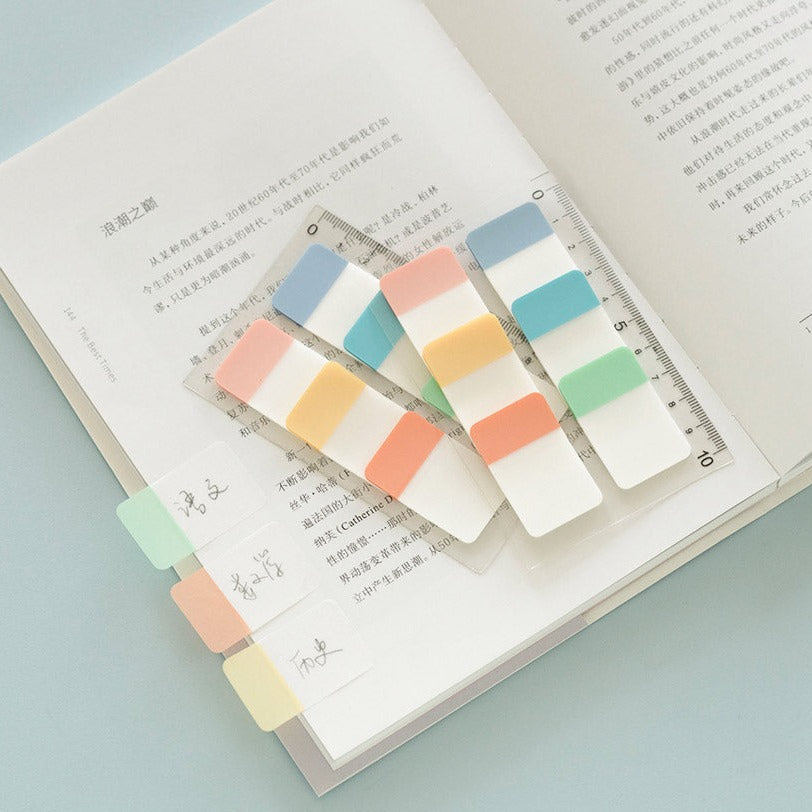 colourful sticky index tab ruler displayed on an open book