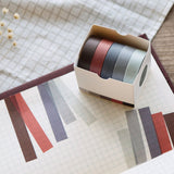 red colour themed washi tape used on a notebook