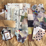 various vintage ephemera paper scattered on a brown paper