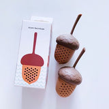 two silicon pine cone shaped tea strainer displayed on a white surface